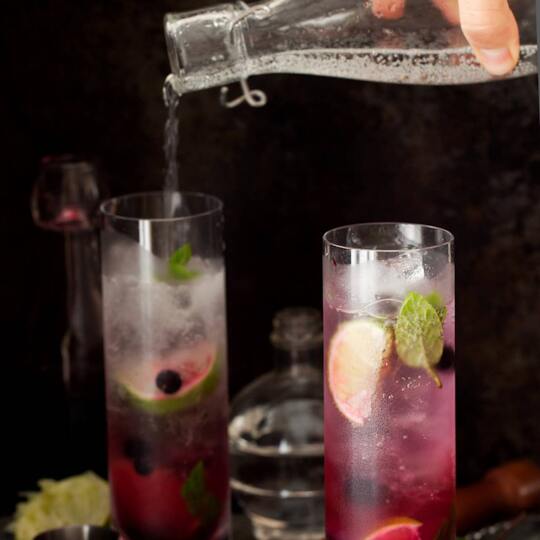 _BLACK CURRANT MOJITO_ /We took the classic mojito and put a twist on it to make a delicious summer-inspired cocktail./ Type: Cocktail. Time: 3 min. Servings: 1. INGREDIENTS: 1 Tablespoon Blackcurrants. 4 Fresh Mint Leaves. ½ oz Fresh Lime Juice. 1 oz Rum (we use Cruzan Light Rum). 1 Tsp Caster Sugar. Club Soda or Tonic Water. Crushed Ice. Lime Wedge (Garnish). Sprig of Mint (Garnish). PREPARATION: 1: Combine the Blackcurrants, mint leaves, lime juice, and caster sugar in a small bowl. 2: Muddle lightly (just enough to break down the mint leaves to release their flavor). 3: Remove the leaves and place the Blackcurrant mixture in the bottom of a Collins glass. 4: Fill the glass halfway with crushed ice and then pour your rum of choice on top. 5: Top it off with club soda or tonic water. Garnish with a lime wedge and a sprig of mint. Enjoy! https://www.currantc.com/blogs/currant-recipes/black-currantc™-mojito