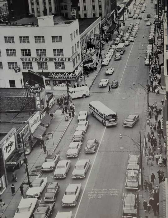 OUELLETTE AVENUE When Windsor's downtown was a beehive of shopping activity: April 1, 1961. A view of Ouellette Avenue from the Dominion Building (now the Paul Martin Building) on Chatham Street, showing the former Heintzman Building--altered so severely as to make it unrecognizable--Palace Theatre, King's Block, and part of the Canada Building and Prince Edward Hotel. From my "Reflections of Windsor." https://www.facebook.com/photo/?fbid=500820321418616&set=a.232563384910979
