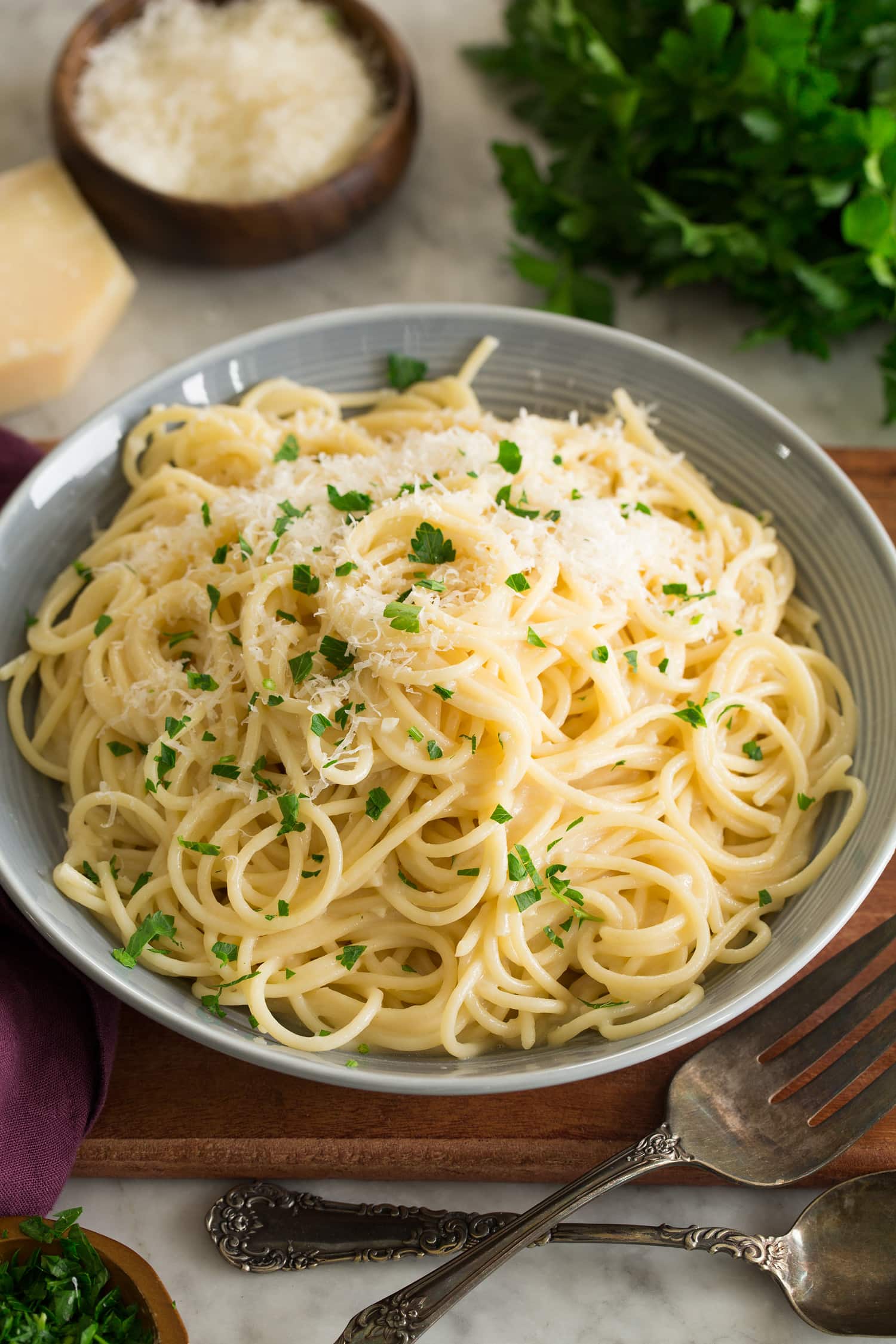 _*Garlic Parmesan Pasta*_ /A super quick and easy pasta recipe! Made with only 4 INGREDIENTS while the secret to the sauce is just the reserved pasta water. It finishes with al dente spaghetti, and a rich and buttery, garlicky parmesan sauce./   #Butter #Garlic #ParmesanCheese #Pasta  Servings: 4 Ready in: 25 minutes Prep: 10 minutes Cook: 15 minutes  Ingredients:  10 oz dry spaghetti Salt and black pepper 1 cup reserved pasta water (from cooking spaghetti) 1/4 cup unsalted butter, cut into 1 Tbsp pieces 1 Tbsp minced garlic (3 cloves) 2 oz. parmesan, finely shredded (I use a rasp grater/zester, 1 heaping cup)  Instructions: *1.* Bring 10 cups water to a boil in a large pot. Season with salt (I use 1 Tbsp).  *2.* Cook pasta to al denta according to directions listed on package.  *3.* Scoop out and reserve 1 cup pasta water, then drain spaghetti.  *4.* Return empty pot to medium-low heat. Melt butter.  *5.* Add garlic and saute until fragrant and just barely deepening in color, about 1 minute.  *6.* Remove from heat. Return drained pasta to pot with butter mixture, pour in 1/2 hot pasta water and toss. Sprinkle in and toss in parmesan cheese, tossing until melted and thinning with more reserved pasta water as needed.  *7.* Season with salt and pepper to taste.  https://www.cookingclassy.com/garlic-parmesan-pasta/?utm_source=pushengage&utm_medium=pushnotification&utm_campaign=pushengage