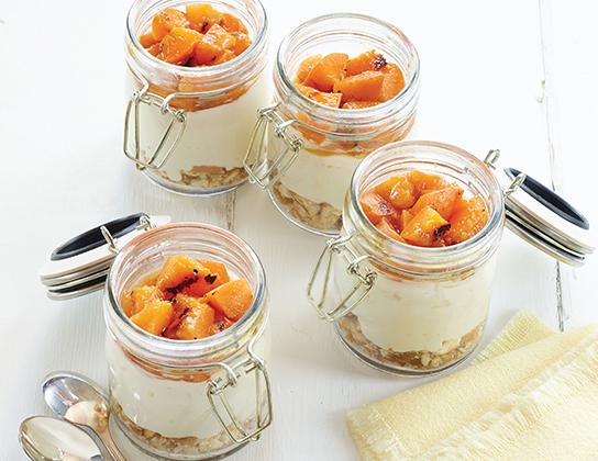 _*Cheesecake in a Jar (with grilled honey fruit)*_ Grilled honey-cinnamon-kissed sweet, juicy fruits make for a delectable topping for these retro, creamy, no-bake cheesecakes. Whether you make them in a jar or ramekin or spoon them into dessert glasses, they will be a big hit. *Chilling Time:* 6 hours *Grilling Time:* 5 minutes *Preparation Time:* 20 minutes *Servings:* 6 *Ingredients* 9 vanilla wafer cookies, crushed 1 tbsp (15 mL) fresh lemon juice 3/4 cup (175 mL) whipping cream (35%) 1 pkg (8 oz/ 250 g) brick cream cheese, softened 1/3 cup (75 mL) icing sugar 1 tsp (5 mL) vanilla *Grilled Honey Fruit:* 6 tbsp (90 mL) Sun Parlor Honey 1 tsp (5 mL) ground cinnamon 2 ripe but firm PGAF Peaches or Nectarines *Instructions* In small bowl, combine crushed vanilla wafers and 2 tsp (10 mL) of the lemon juice; divide among six 1/2-cup (125 mL) jelly jars or ramekins. Set aside. In chilled bowl, whip cream. In large bowl, beat together cream cheese, sugar, remaining 1 tsp (5 mL) lemon juice and vanilla until creamy and smooth; fold in whipped cream until blended. Spoon mixture on top of cookies in jars and smooth tops. Cover and refrigerate until firm, 6 hours or overnight. *Grilled Honey Fruit:* In small bowl, whisk honey with cinnamon; set aside. Halve and pit fruits; brush all over with honey mixture. Place fruit, cut side down, on greased grill over medium-high heat; grill, covered, for 5 minutes or until warm and grill marked. Let cool slightly; cut into bite-size pieces. Spoon fruit on top of cheesecake; drizzle with any remaining honey-cinnamon mixture. *Tips:* Try 4 Apricots or Plums instead of the peaches. Or top with fresh seasonal berries; no need to grill, just toss with honey to taste. If the honey is thick, warm slightly in -the microwave- boiled water.