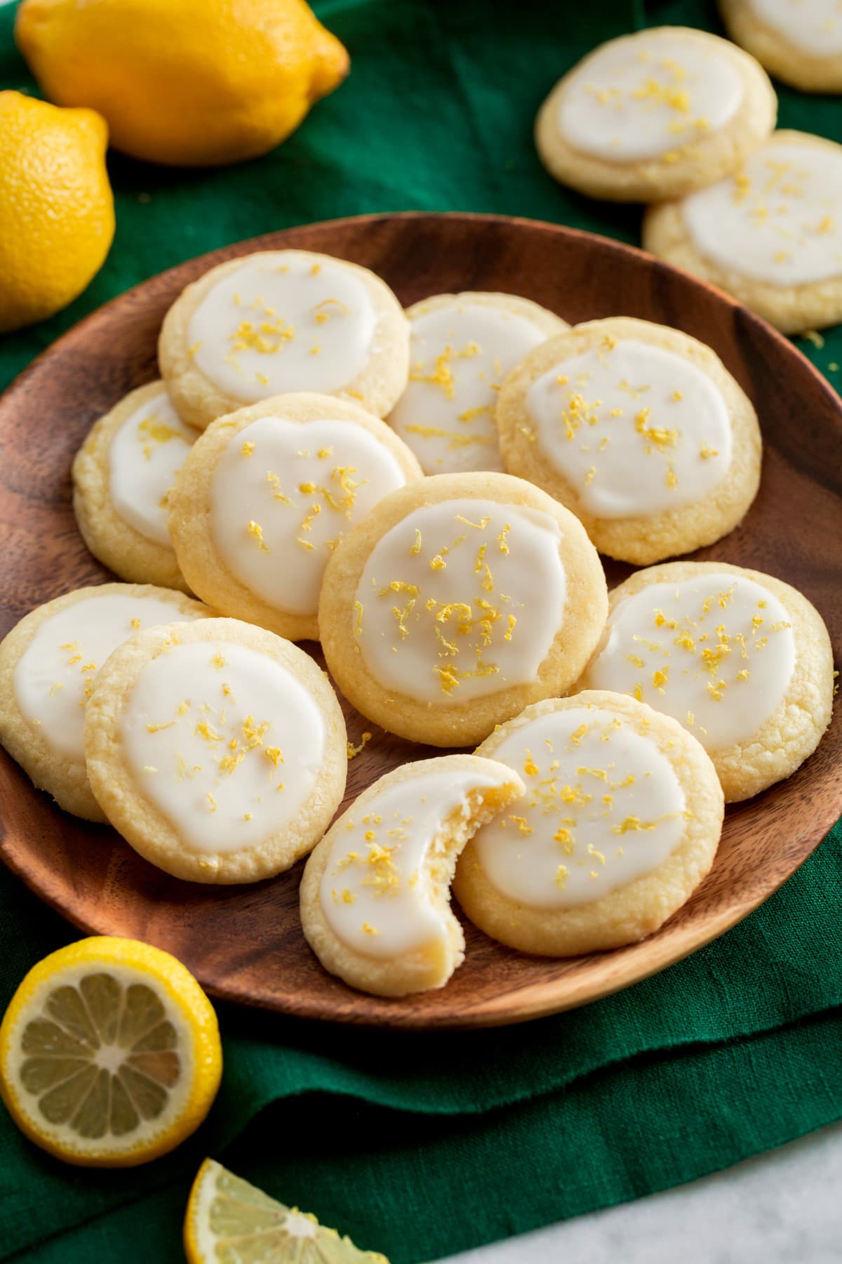 _*Lemon Meltaway Cookies*_ /It's a buttery and tender cookie with a delicious fresh lemon taste and a sweet and vibrant glaze. After one bite they may just become a new favorite!/ #Butter #Cornstarch #EggYolks #Flour #Lemons #PowderedSugar Servings: 36 cookies Ready in: 50 minutes Prep: 25 minutes Cook: 10 minutes Ingredients: 1 3/4 cups (248g) all-purpose flour (scoop and level to measure) 1 Tbsp (8g) cornstarch 1/4 tsp (heaping) salt 1 cup (120g) powdered sugar 1 cup (226g) unsalted butter, nearly room temperature 2 Tbsp lemon zest,* plus more for garnish if desired 2 large egg yolks Glaze 1 cup powdered sugar 1 1/2 Tbsp fresh lemon juice, plus another 1/2 Tbsp as needed Instructions: *1.* Preheat oven to 350 degrees. Line two baking sheets with parchment paper. *2.* In a medium mixing bowl whisk together flour, cornstarch and salt. *3.* In the bowl of an electric stand mixer** mix together 1 cup powdered sugar, butter and lemon zest on low speed until combined. Increase mixer speed to medium-high and whip until slightly pale and fluffy, about 1 - 2 minutes. *4.* Scrape down bowl then mix in egg yolks 1 at a time, blending after each addition. Scrape down bowl. *5.* Add flour mixture to butter mixture and blend until combined (it will seem dry and crumbly at first, keep mixing and it will come together). If dough is sticky at this point you can chill it for 30 minutes but you shouldn't need too if using cool butter. *6.* Scoop dough out 1 Tbsp at a time and transfer to the baking sheet spacing cookies 2-inches apart. Evenly flatten cookies with the heel of your hand to about 1/3-inch thickness*** (spray hand with cooking spray if needed to reduce sticking). *7.* Bake one sheet at a time until cookies appear dry on the surface yet are just slightly soft when pressed, about 8 to 10 minutes. *8.* Let cool on baking sheet for 5 minutes then transfer to wire rack to cool completely. Repeat process with second sheet of cookies. *9.* To make the glaze in a small mixing bowl whisk together 1 cup powdered sugar with the lemon juice. Thin with more lemon juice as needed. *10.* Spoon glaze over cookies and spread into a small thin round. Garnish with a little lemon zest if desired. *11.* Once glaze has set store cookies in a single layer in an airtight container. They'll keep several days at room temperature but can also be refrigerated or frozen for longer shelf life. Notes: *Use a zester to get the zest of the lemon rather than something like a cheese grater (you'd end up with some of the white pith of a lemon if using a cheese grater and cookies will be bitter). **Cookies can also be made using a mixing bowl and a hand mixer rather than a stand mixer. I've had success with both options. ***Keep in mind cookies will spread some so don't flatten very much.