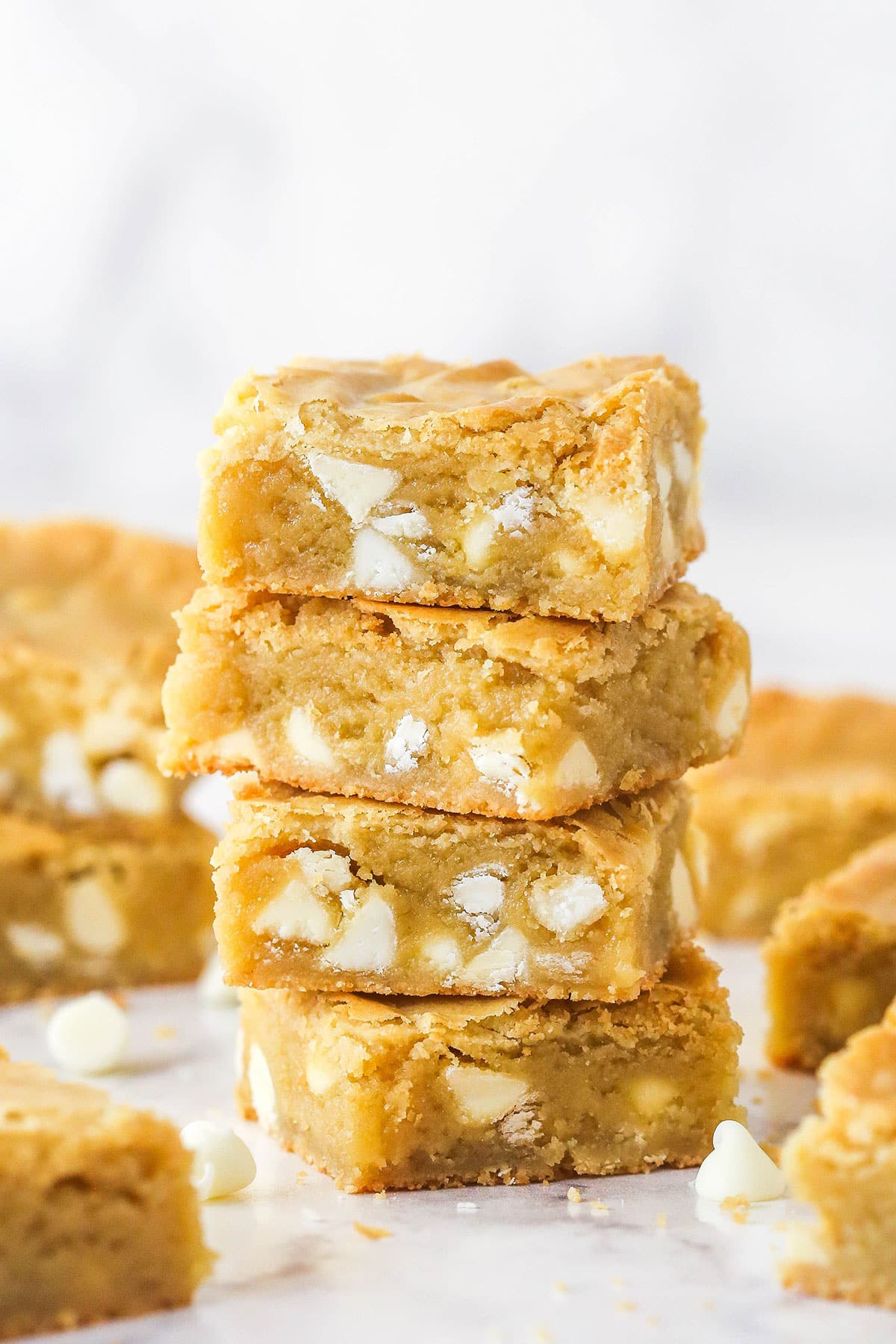 _*Blondies*_ /The best Blondies recipe! Made with sweet, vanilla flavor, they're soft and moist in the center yet slightly crisp on the outside. Studded with gooey white chocolate chips in every bite, they're sure to satisfy the strongest sweet tooth/ #BrownSugar #Butter #Eggs #Flour #VanillaExtract #Walnuts #WhiteChocolateChips Servings: 15 Ready in: 35 minutes Prep: 15 minutes Cook: 20 minutes Ingredients: 2 cups (282g) all-purpose flour, preferably unbleached (scoop and level to measure) 3/4 tsp salt 1/8 tsp baking soda* 1 cup (226g) unsalted butter, cut into pieces (for faster melting) 1 1/2 cups (300g) packed light brown sugar 2 large eggs 2 tsp vanilla extract 1 cups (172g) white chocolate chips 1 cup (98g) chopped walnuts (optional) Instructions: *1.* Preheat oven to 350 degrees. Butter a 9 by 13-inch baking dish, line with parchment paper and butter parchment paper, set aside. *2.* In a mixing bowl whisk together flour, baking soda and salt. *3.* Place butter in a large microwave safe mixing bowl. Heat in microwave until melted. Remove and let cool for a few minutes. *4.* Add brown sugar to butter and stir mixture with a wooden spoon to blend. *5.* Add eggs and vanilla. Break yolks with the spoon then stir mixture just to combined. *6.* Pour in flour mixture then fold and stir just to combined. *7.* Mix in white chocolate chips and walnuts if using. *8.* Spread batter into prepared baking dish. Bake in preheated oven until set (top should no longer appear raw), and toothpick inserted into center comes out clean, about 20 - 25 minutes. *9.* Let cool for about 20 minutes before cutting into squares. Notes: Only 1/8 tsp baking soda makes for a dense blondie similar to a brownie. If you want fluffier bars you can increase to as much as 1/2 tsp baking soda.