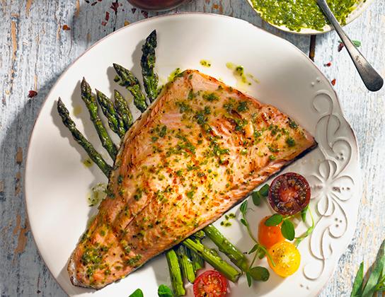 _*Asparagus and Trout with Parsley Sauce*_ /This parsley-garlic sauce works well with Ontario rainbow trout, asparagus and even potatoes./   #CalendarRecipe #Dinner  Serves: 4 Grilling Time: 15 minutes Preparation Time: 15 minutes  Ingredients:  1 lb (500 g) Ontario Asparagus, trimmed 2 tbsp (25 mL) olive oil Salt and freshly ground black pepper, to taste 2 Ontario Rainbow Trout Fillets (375 g each) Sauce: 1 cup (250 mL) fresh Ontario Parsley Leaves 1/4 cup (50 mL) fresh Ontario Tarragon Leaves 2 cloves garlic 2 tbsp (25 mL) white wine vinegar 1 tbsp (15 mL) water 1/4 tsp (1 mL) crushed red pepper flakes 1/4 tsp (1 mL) salt 1/4 cup (50 mL) olive oil    Instructions: *1.* Sauce: In food processor, combine parsley, tarragon, garlic, vinegar, water, red pepper flakes and salt; pulse until coarsely chopped, scraping side of bowl. With machine running, slowly pour in oil until mixture is finely chopped. Set aside.  *2.* In bowl, toss asparagus with 1 tbsp (15 mL) of the oil; season with salt and pepper.  *3.* Cut each fillet in half; brush flesh side with remaining oil. Season with salt and pepper.   *4.* Place asparagus on greased grill over medium-high heat; grill for about 8 minutes, turning once, or until tender. Return to bowl; toss with 1 tbsp (15 mL) of the sauce.  *5.* Grill trout pieces, skin side down; for about 6 minutes, turning once, or until fish flakes easily with fork. Place on platter, skin side down; spread lightly with sauce. Serve with asparagus and remaining sauce.