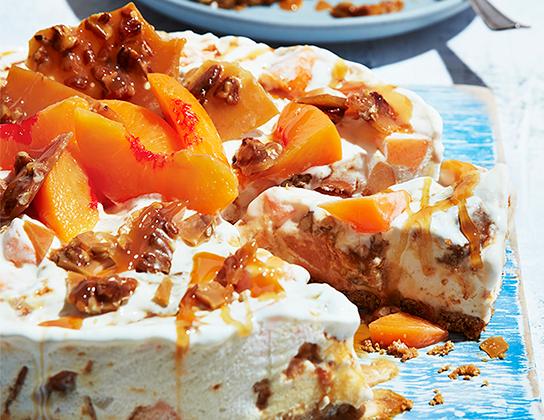 _*Frozen Peach Pecan Crunch Cake*_ /The easiest way to make a small batch of pralines is in the microwave. Chop the buttery candy and fold into vanilla ice cream along with diced fresh peaches./   #Dessert #CalendarRecipe  Cooking Time: 6 minutes Cooling Time: 30 minutes, Freezing Time: Overnight Preparation Time: 30 minutes  Ingredients:  Pecan Crunch: 1 cup (250 mL) granulated sugar  3 tbsp (45 mL) warm water   1/4 cup (50 mL) butter  1/2 cup (125 mL) chopped pecans Cake: 1-1/2 cup (375 mL) graham crumbs 1/4 cup (50 mL) melted butter  1.5 L Ontario Vanilla Ice Cream  2 cups (500 mL) diced, peeled Ontario Peaches  1 Ontario Peach, peeled and sliced  Caramel sauce    Instructions: *1.* Pecan Crunch: Lightly grease rimmed baking sheet. In heavy 4 cup (1 L) glass measure, stir sugar and water together; add butter. Microwave on High until boiling, about 2 minutes. Stir to melt butter. Microwave on High for 4 minutes, until golden brown and bubbling. Stir in pecans; spread onto prepared pan; let cool completely. Break into pieces, then chop (makes about 2 cups/500 mL). Set aside.  *2.* Cake: Line bottom of 10-inch (3 L) springform pan with parchment paper. In medium bowl, stir crumbs and melted butter until coated. Press evenly into bottom of pan. Freeze while making filling.   *3.* In large bowl, soften ice cream. Stir in diced peaches and 1-1/2 cup (375 mL) of the pecan crunch. Spoon over base. Cover with foil; freeze until firm, preferably overnight.      Remove from freezer to refrigerator about 30 minutes before serving. Remove ring; top with peach slices and reserved pecan crunch. Drizzle with caramel sauce.  