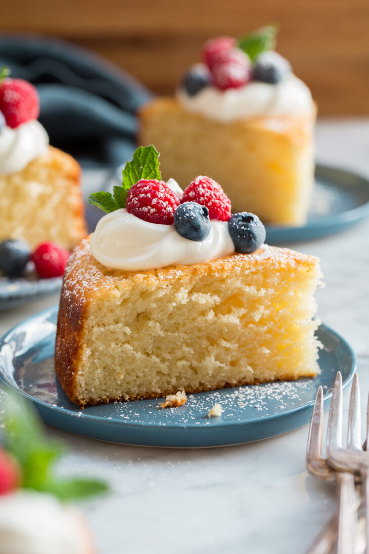 _*Yogurt Cake*_ /Easy Yogurt Cake! It’s an irresistible cake made a bit healthier with Greek yogurt and olive oil, and it has a moist crumb with a texture similar to muffins or pound cake.  It’s delicious topped with whipped cream or sweetened yogurt and fresh berries, or keep it simple and dust with a light powdered sugar finish or drizzle with honey./   #Eggs #Flour #GreekYogurt #OliveOil #Sugar #VanillaExtract  Servings: 10 Ready in: 55 minutes Prep: 20 minutes Cook: 35 minutes  Ingredients:  1 3/4 cups (248g) all-purpose flour (scoop and level to measure) 2 tsp baking powder 1/4 tsp baking soda 1/2 tsp salt 1 cup (200g) granulated sugar* 1 1/4 cups (304g) whole plain Greek yogurt, brought to room temperature 2/3 cup olive oil** 3 large eggs, brought to room temperature 2 tsp vanilla extract  Instructions: *1.* Preheat oven to 350 degrees. Spray a 9-inch springform pan with non-stick spray, line bottom with a round of parchment paper and spray parchment paper. Set aside.  *2.* In a medium mixing bowl whisk together flour, baking powder, baking soda and salt.  *3.* In a separate mixing bowl whisk together sugar, yogurt, olive oil, eggs and vanilla extract until well blended.  *4.* Pour flour mixture into yogurt mixture then stir mixture until combined.  *5.* Pour batter into prepared springform pan and spread into an even layer. Bake until toothpick inserted into center comes out clean or with a few moist crumbs, about 33 to 36 minutes.  *6.* Let cool slightly before slicing and serving.   Notes: *You can use 1 1/4 cups sugar for a sweeter cake, this is lightly sweet as is. **Don't use extra virgin olive oil unless you want a more pronounced flavor. Regular or light olive oil are recommended. Another option is to use vegetable oil or canola oil. If desired cake can be served with sweetened whipped cream or sweetened yogurt (using powdered sugar), and fresh berries.