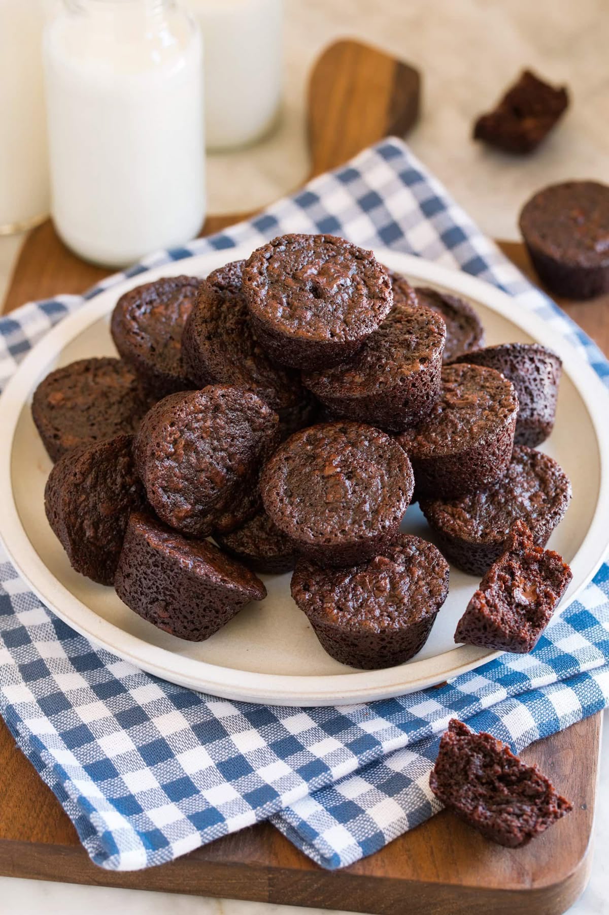 _*Brownie Bites*_ /Brownie Bites are a bite size version of the traditional, homemade fudgy brownies we crave! They are perfectly chocolatey, deliciously buttery, and make a great base for a mini swirl of luscious frosting./   #BrownieBitesBrownieBitesRecipe #BrowniesBars #Desserts #Butter #ChocolateChips #CocoaPowder #Eggs #Flour #GranulatedSugar #VanillaExtract  Prep: 15 minutes. Cook: 15 minutes. Ready in: 30 minutes.  INGREDIENTS: 1: 9 Tbsp unsalted butter, cut into 1 Tbsp pieces. 2: 1 cup (200g) granulated sugar. 3: 1/4 tsp (heaping) salt. 4: 2 large eggs. 5: 1 1/2 tsp vanilla extract. 6: 2/3 cup (86g) all-purpose flour (spoon and level to measure). 7: 6 Tbsp (36g) Dutch process cocoa powder, plus 2 tsp for dusting pan. 8: 1/2 cup (85g) mini semi sweet chocolate chips*.  INSTRUCTIONS:  1: Preheat oven to 325 degrees. 2: Spray a 24 cup mini muffin pan with non-stick cooking spray and dust with 2 tsp cocoa powder. Shake to coat evenly and set aside. 3: Place butter in a large microwave safe mixing bowl. Heat until just melted in microwave. Let cool slightly. 4: Whisk in sugar and salt, then whisk in eggs and vanilla extract. Blend well. 5: Add flour and cocoa powder and stir mixture until combined, while scraping sides and bottom of bowl. 6: Stir in chocolate chips. 7: Scoop batter out about 1.5 Tbsp at a time (I use a #40 scoop) and drop into prepared muffin pan filling nearly full. 8: Bake in preheated oven until just set, about 15 to 17 minutes (you can test with a toothpick in center, it should be free of batter). 9: Let cool in pan 15 minutes before removing and transferring brownie bites to a wire rack to finish cooling. 10: If desired top with frosting, my favorite is to top it with a small swirl of cream cheese frosting (recipe listed in notes below). Notes: *I do not recommend regular size chocolate chips in this recipe, the minis mostly melt in and make the brownie bites more fudgy as they are tinier and are spread more evenly throughout. For the cream cheese frosting: in a large mixing bowl using an electric hand mixer set on low speed blend together 3 oz. cream cheese (slightly softened), 4 Tbsp (56g) unsalted butter softened, 1 tsp vanilla extract, and 2 cups (240g) powdered sugar. Increase mixer speed to high and whip until light and fluffy, about 2 minutes. Pipe or spread over brownie bites. Frosting is not included in nutrition estimate as this is optional.  