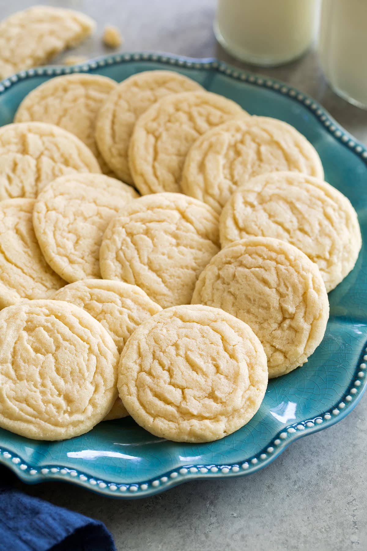 _*Sugar Cookies*_ /Sugar Cookies! A classic cookie recipe for an irresistible, soft, chewy and perfectly sweetened cookie that uses everyday basic ingredients. Perfect for when those cookie craving strike!/ #Butter #EggYolks #Eggs #Flour #Sugar #VanillaExtract Servings: 32 Ready in: 30 minutes Prep: 15 minutes Cook: 10 minutes Ingredients: 2 1/2 cups (354g) all-purpose flour (scoop and level to measure, don't spoon and level) 1/2 tsp baking soda 1/2 tsp baking powder 1/2 tsp salt 1 1/2 cups (300g) granulated sugar 1 cup (226g) unsalted butter, softened 1 large egg 1 large egg yolk 1 Tbsp vanilla Instructions: *1.* Preheat oven to 350 degrees. Line baking sheets with parchment paper or silicone liners. *2.* In a mixing bowl whisk together flour, baking soda, baking powder and salt, set aside. *3.* In the bowl of an electric stand mixer cream together butter and sugar until well combined. *4.* Mix in egg, egg yolk and vanilla. *5.* Add in flour mixture and mix just until combined. If cookie dough seems very soft chill for 1 hour before proceeding so cookies spread less. *6.* Scoop dough out using a medium cookie scoop (or 1 1/2 Tbsp at a time, and roll into balls if not using a cookie scoop) and drop onto baking sheet, spacing them 2-inches apart. *7.* Bake in preheated oven 9 - 11 minutes, they should appear slightly under-baked. If baking two batches at once then rotate pans halfway through baking. *8.* Cool on pan 5 minutes then transfer to a wire rack to cool completely. *9.* Store cookies in an airtight container. https://www.cookingclassy.com/sugar-cookies/