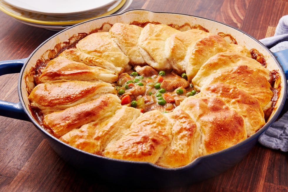 _*Skillet Chicken Pot Pie*_ /Nothing warms you up on a cold day quite like chicken pot pie. This shortcut version comes together surprisingly fast, despite tasting like something it would've taken your grandma all day to make. The perfect no-fuss dinner, it's on our permanent rotation all winter long./ /Made it? Let us know how it went in the comment section below!/   #ChickenPotPie  YIELDS: 6 - 8 TOTAL TIME: 1 hr PREP TIME: 10 mins Ingredients: 1 tbsp. olive oil 3 boneless, skinless chicken breasts, cut into 1" chunks kosher salt Freshly ground black pepper 1/2 onion, chopped 2 medium carrots, peeled and chopped 2 stalks celery, chopped 2 tsp. fresh thyme 3 tbsp. flour 1 1/2 c. frozen peas 2 c. chicken broth 2 tbsp. heavy cream 1 can refrigerated biscuit dough 1 Egg, lightly beaten  Directions: Step 1 Preheat oven to 350°. In a large skillet over medium heat, heat oil. Add chicken and season with salt and pepper. Cook until golden on all sides, 6 to 8 minutes.  Remove from skillet.  Step 2 Add onion, carrots, celery, and thyme and cook until vegetables are soft, 4-5 minutes. Sprinkle flour over vegetables and cook 2-3 minutes more. Add chicken broth and bring to a simmer, cooking 8-10 minutes more, until slightly thickened. Turn off heat and stir in cream, peas, and chicken.  Step 3 Remove biscuits from can and slice in half horizontally. Arrange, overlapping, in a ring on the outer circle of the skillet. Brush with egg wash and bake until golden, 25-30 minutes.