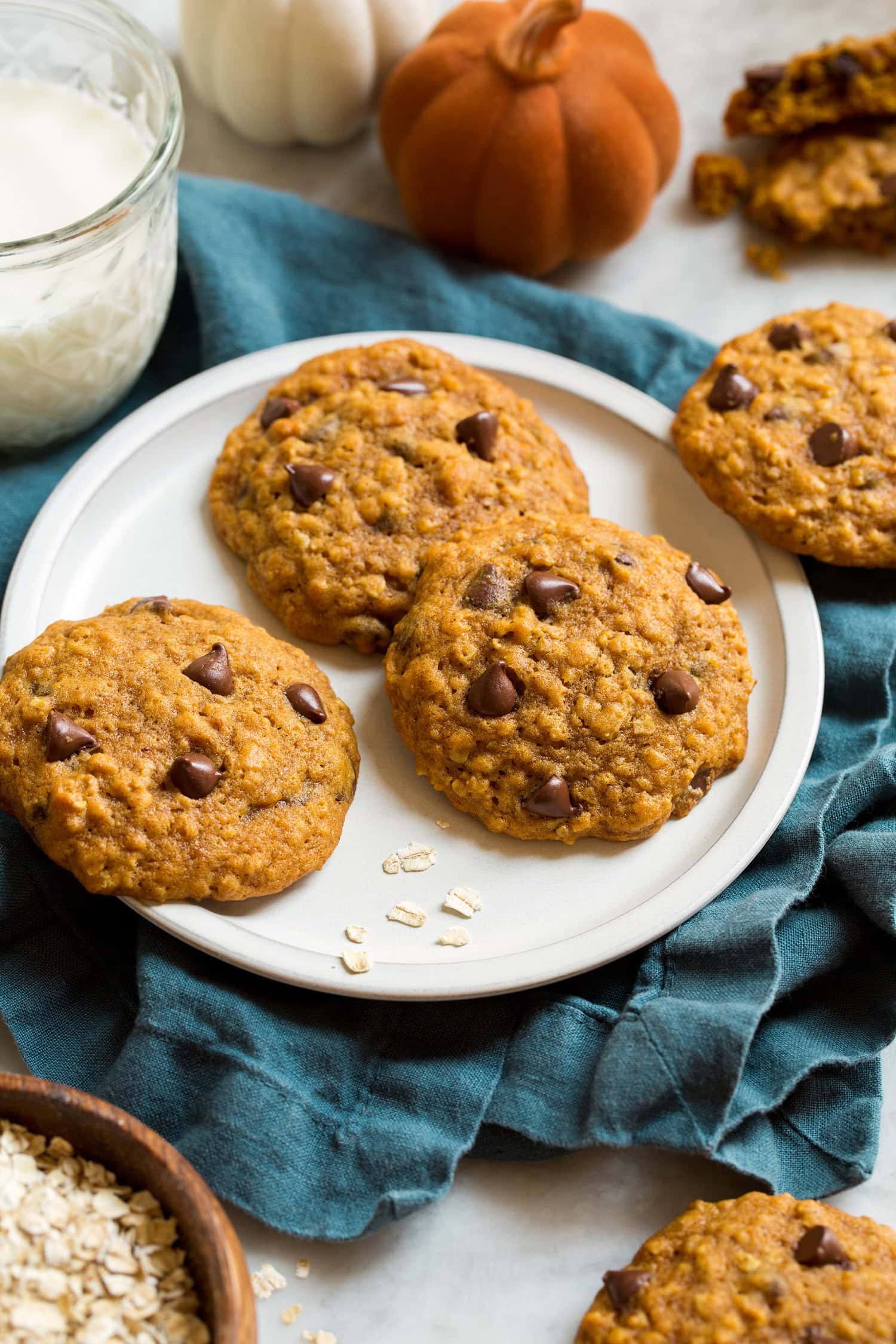 _*Pumpkin Oatmeal Chocolate Chip Cookies*_ /Pumpkin Oatmeal Chocolate Chip Cookies – A trio of three delicious flavors including pumpkin, oats and chocolate chips come together to create one unforgettable autumn treat!/   #Cookies #Desserts #BrownSugar #Butter #Cinnamon #Eggs #Flour #Ginger #Nutmeg #Oats #Pecans #Pumpkin #Sugar #VanillaExtract #Walnuts  Prep: 20 minutes. Cook: 14 minutes. Ready in: 34 minutes.  Ingredients: 1: 2 1/4 cups (319g) all-purpose flour (scoop and level to measure). 2: 1 1/2 cups (140g) quick oats. 3: 1 tsp baking soda. 4: 3/4 tsp salt. 5: 2 tsp ground cinnamon. 6: 1/4 tsp ground nutmeg. 7: 1/4 tsp ground ginger. 8: 1/8 tsp ground cloves (optional). 9: 1 cup (226g) unsalted butter , softened. 10: 1 1/3 cups (266g) packed light-brown sugar. 11: 2/3 cup (133g) granulated sugar. 12: 1 large egg. 13: 1 tsp vanilla extract. 14: 1 1/4 cups (290g) canned pumpkin puree. 15: 1 3/4 cup (290g) semi-sweet chocolate chips. 16: 1 cup (130g) chopped pecans or walnuts (optional).  Instructions: 1: Preheat oven to 350 degrees. In a mixing bowl whisk together flour, oats, baking soda, salt, cinnamon, nutmeg and ginger for 30 seconds, set aside. 2: In the bowl of an electric stand mixer fitted with the paddle attachment cream together butter, brown sugar and granulated sugar until creamy (occasionally stop and scrape down sides and bottom of bowl throughout entire mixing process). 3: Blend in egg then blend in vanilla extract and pumpkin puree. With mixer set on low speed, slowly add in dry ingredients and mix until combined. Mix in chocolate chips and pecans (if you want some chocolate to show through set some aside to press into tops before baking). 4:  Let batter rest 10 minutes (this just gives the oats some time to absorb the liquids so batter isn't so sticky and cookies don't spread so much). 5: Scoop dough out 2 Tbsp at a time (I used a 1 1/2-inch cookie scoop, which I recommend using for evenly shaped cookies and fill it heaping), and drop onto Silpat or parchment paper lined baking sheets, spacing cookies 2-inches apart. 6: Bake in preheated oven 13 - 15 minutes. Allow to cool on baking sheet several minutes then transfer to a wire rack to cool completely. Store cookies in an airtight container. Notes: For a more orange pumpkin hued cookie you can mix in a few drops red and yellow natural food coloring when you add the pumpkin to the cookie dough. Nuts not included in nutrition estimate as these are optional.  
