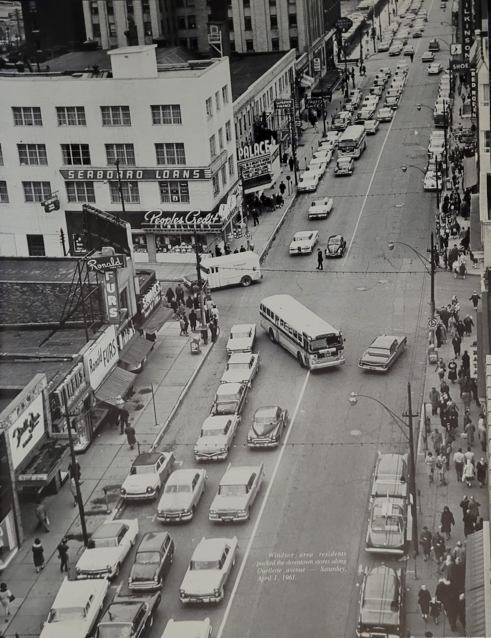 OUELLETTE AVENUE When Windsor's downtown was a beehive of shopping activity: April 1, 1961. A view of Ouellette Avenue from the Dominion Building (now the Paul Martin Building) on Chatham Street, showing the former Heintzman Building--altered so severely as to make it unrecognizable--Palace Theatre, King's Block, and part of the Canada Building and Prince Edward Hotel.  From my "Reflections of Windsor."  https://www.facebook.com/photo/?fbid=500820321418616&set=a.232563384910979