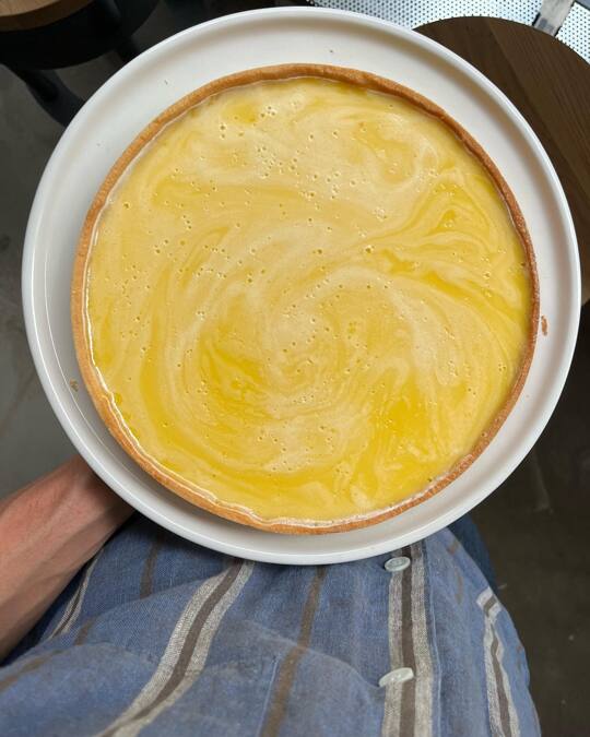 @amatorcph citrus tart is a symbol of my deep pride. Because empowering others simply tastes so much better than focusing on yourself. It’s my sixth year of my career as a leader in gastronomy. I’m deeply proud of every colleague who I hired and pushed into direction to develop as a professional and a human. And again it’s not about me. It’s about allowing to connect my intuition with a human energy willing to be hired and then just trying to understand them and give them opportunity to grow. They will grow themselves if the space is right.
I didn’t make that tart. Haven’t baked one in my life. I had an idea based on our yellow dot/circle logo that it could be ideal to create a lemon tart. A good lemon tart is delicious and easy to understand. It quickly became a citrus tart as a family of citrus has so much to offer throughout the year. @lukecyriacks took the task with professionalism, passion and joy. This is how we created the Full Moon and the Slice of Heaven. You can laugh about those names because they are jokes indeed. On the other hand they are not - the tart feels like heaven in your mouth and the whole pie looks like 🌕 When @maxlamanna (doing plant based diet) tried a piece for purely research reasons had an actual foodgasm claiming his eyes to be twitching. Ask him if you don’t believe. Or just try yourself as you can now just pop-in to us anytime between 9AM-2PM from Thursday til Monday until summer holidays start on the 8th of July.
Today on the actual Full Moon Luke was teaching @mathildesoltoft how to prep it and again I can’t feel more proud as she was the one who I hired at @atelierseptember 5 years ago when she was only 16 ready to wash any amount of dishes. Today becoming a pastry chef of @amatorcph and growing every day to become greater and greater human being. Thank you Luke & Matilde and every other soul who I had a chance to work with. There is so much I can learn from you all 🫶
!København Ø! @olicoool