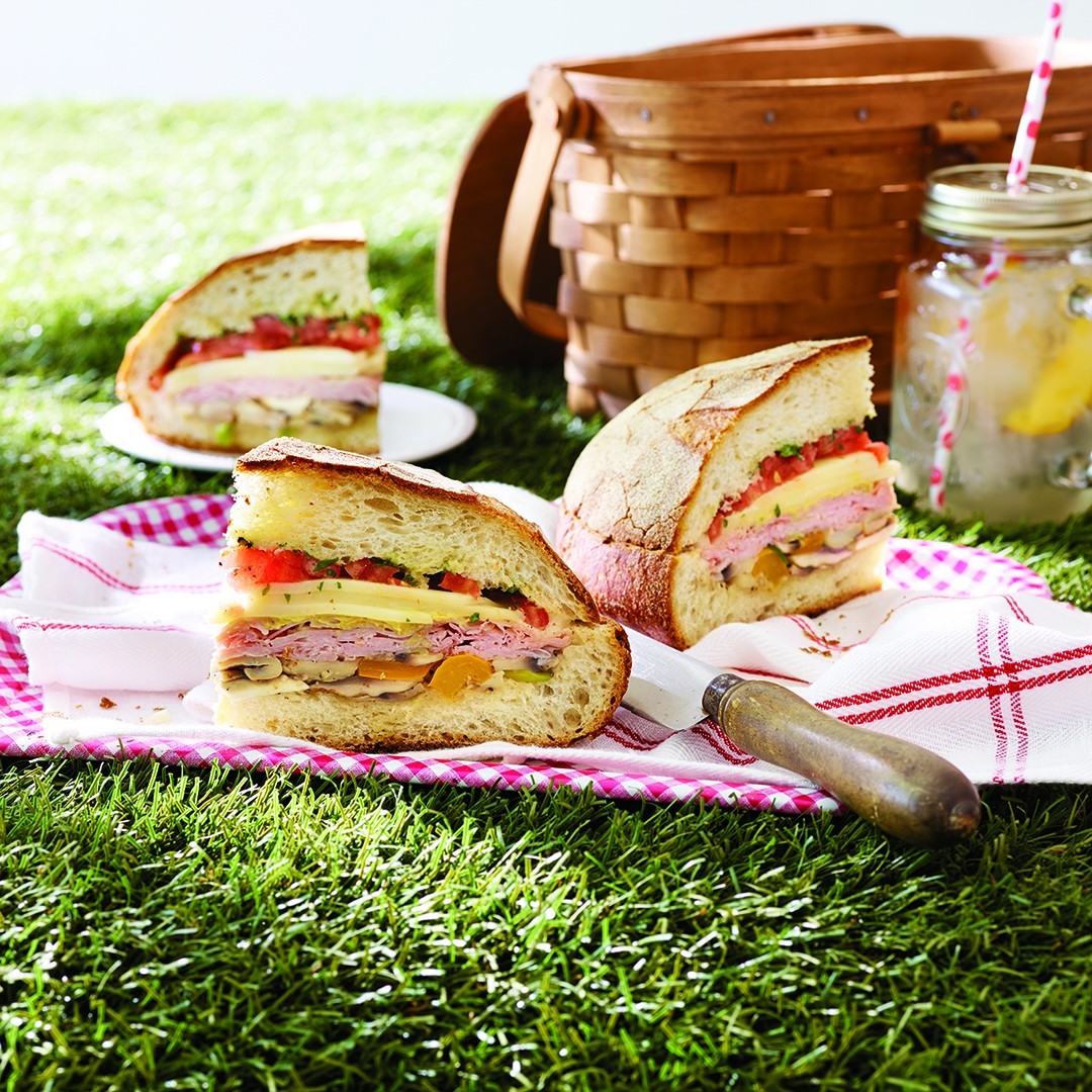 Get ready to sink your teeth into this hearty Muffuletta Sandwich! It's packed with the bounty of Ontario, from fresh veggies to savoury meats. You can make it ahead of time for a quick summer lunch or dinner.

Click the link in our bio for the recipe!foodlandontario