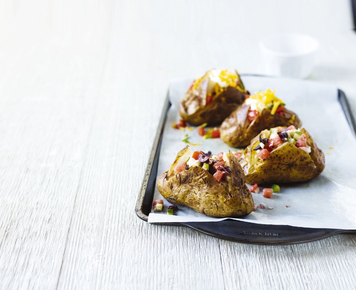 These easy Potato Toppers are fun for the whole family! Everyone can customize their Ontario baked potatoes with either Greek or Mexican inspiration.