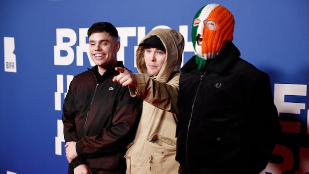 Ireland's Kneecap apologized after footage emerged of one of the trio appearing to say 'Kill your local MP' during a performance in 2023. The group has caused a firestorm this month, beginning with a Coachella set that included provocative statements about the war in Gaza.