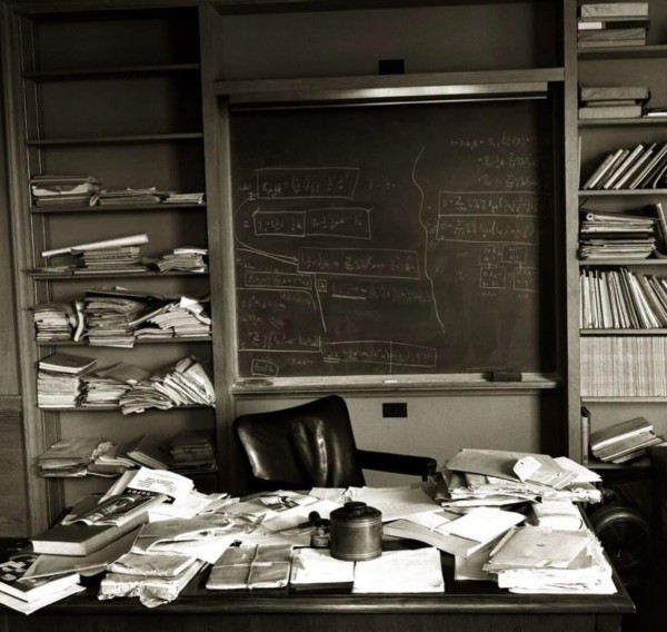 On April 18, 1955, Albert Einstein passed away at the age of 76 in Princeton, New Jersey. While journalists and photographers rushed to Princeton Hospital, LIFE magazine photographer Ralph Morse sought a more intimate perspective. Instead of joining the crowd, Morse approached Einstein's office at the Institute for Advanced Study, where, with a discreet gift of a bottle of scotch to the building's superintendent, he gained entry. Inside, he captured hauntingly intimate photographs of Einstein&rsquo;s workspace mere hours after his death. The images reveal a cluttered desk piled with papers, journals, and a pipe, alongside a chalkboard filled with equations that Einstein had been wrestling with. Each object and scribble offers a window into the mind of a man constantly engaged with ideas, his intellectual curiosity never resting, even in his final hours. These photographs are poignant not for their grandeur but for their intimacy, showing Einstein not as a distant legend, but as a human being surrounded by the tools of his relentless inquiry. Morse&rsquo;s choice to focus on the office rather than the hospital allowed the world a rare glimpse of Einstein in the environment where he lived and thought. The cluttered desk and chaotic yet purposeful surroundings symbolise the genius that emerged from apparent disorder, echoing Einstein&rsquo;s own reflection: &ldquo;If a cluttered desk is a sign of a cluttered mind, of what, then, is an empty desk a sign?&rdquo; In these quiet hours, long after the world had lost him, Einstein&rsquo;s presence remained palpable through the objects he touched and the equations he left unfinished. Ralph Morse&rsquo;s photographs immortalise that presence, transforming a simple workspace into a lasting testament to a brilliant, endlessly inquisitive mind.